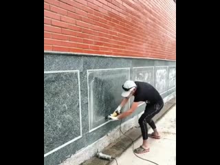 yazhehozhain l artfully paints with a grinder on granite