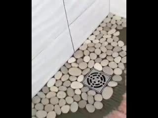 jazhehozayin l pebbles on the floor in the shower